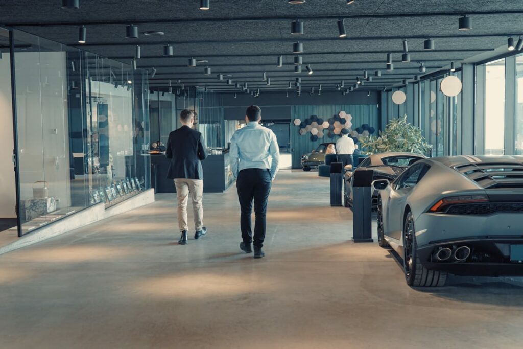 a group of men walking in a showroom
