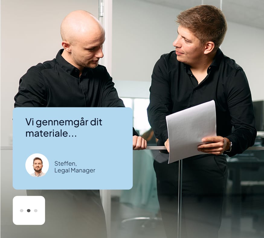 two men looking at a sign