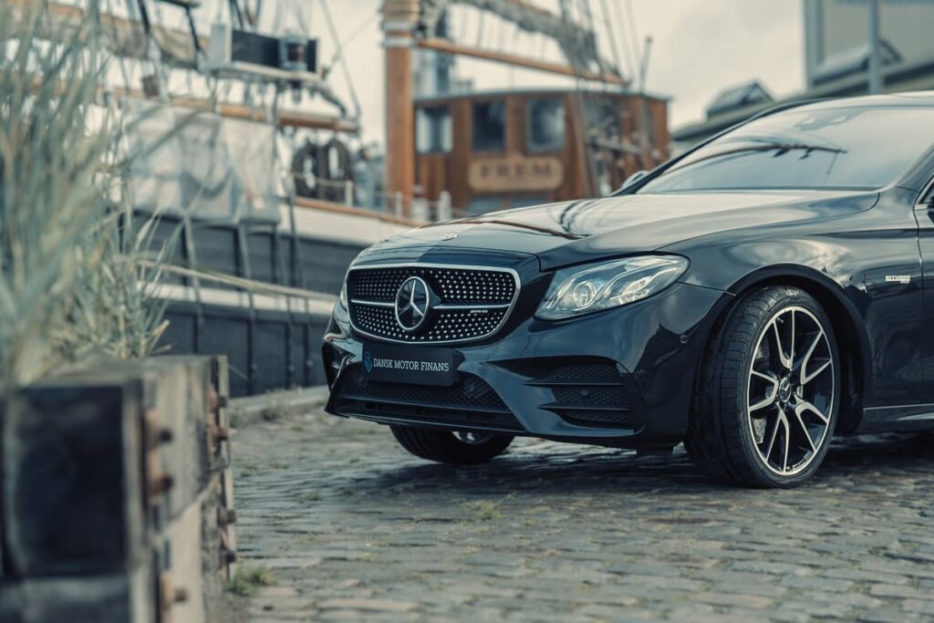 a black car parked on a brick road