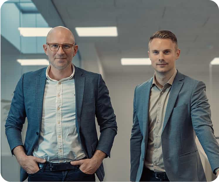 two men standing in a room